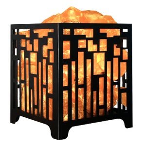 Himalayan Salt Lamp in decorative metal basket with natural orange salt crystals glowing