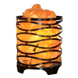 Himalayan Salt Lamp in decorative metal basket with natural orange salt crystals glowing